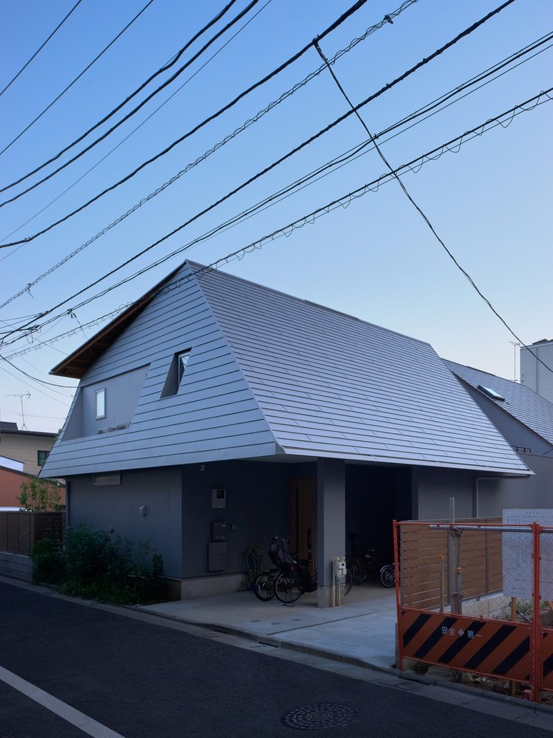 Two Large Roofs Leaning Together