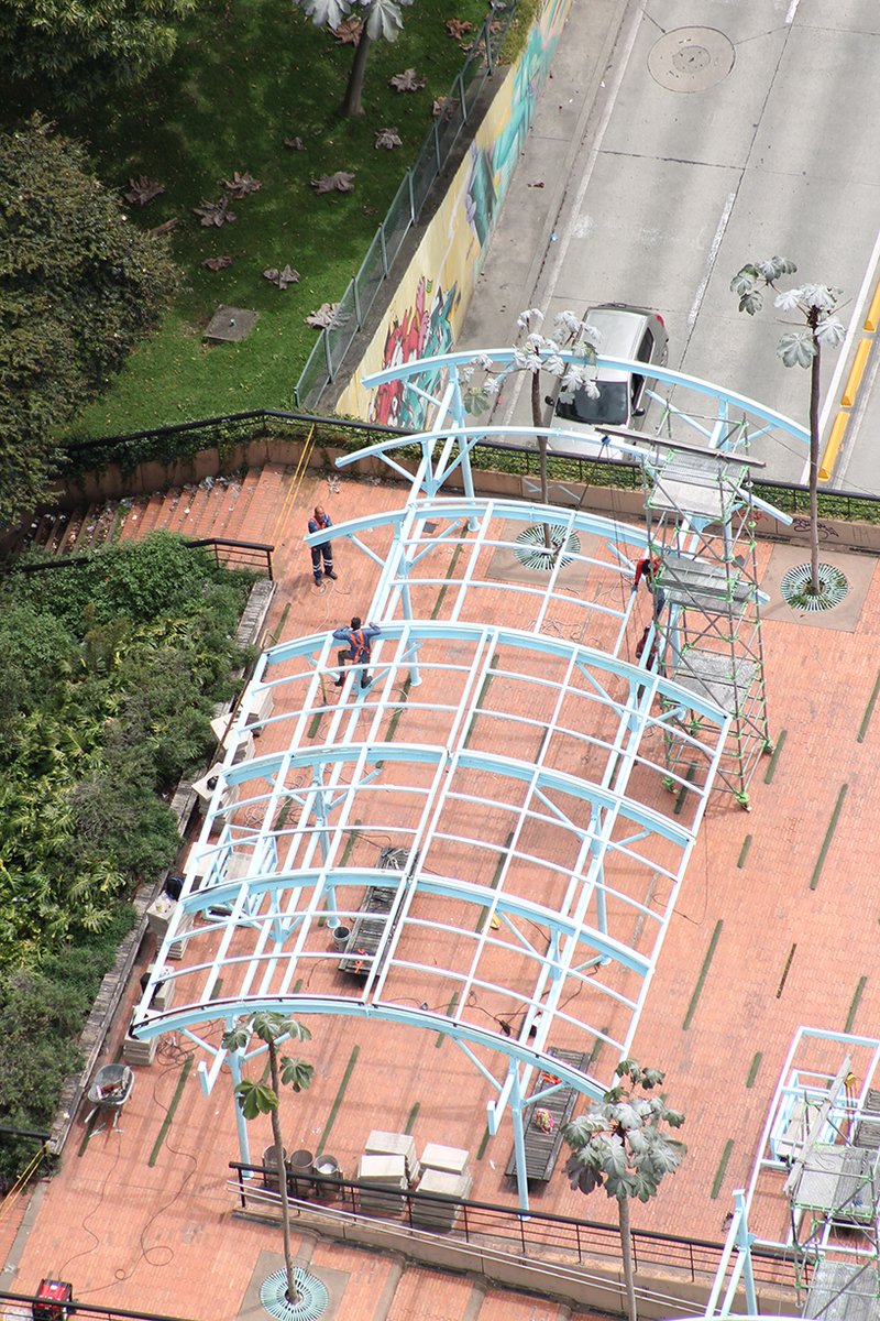 blue fabric fragments dance with the wind on modular cultural pavilion in colombia